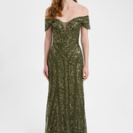 Woman wearing a green off-shoulder evening gown on a white background