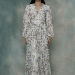 Woman wearing a ruffle maxi dress, designed by BEAUUT