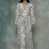 Woman wearing a ruffle maxi dress, designed by BEAUUT