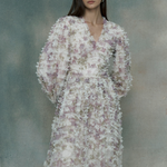 Woman wearing a multicolor ruffle maxi dress, designed by BEAUUT