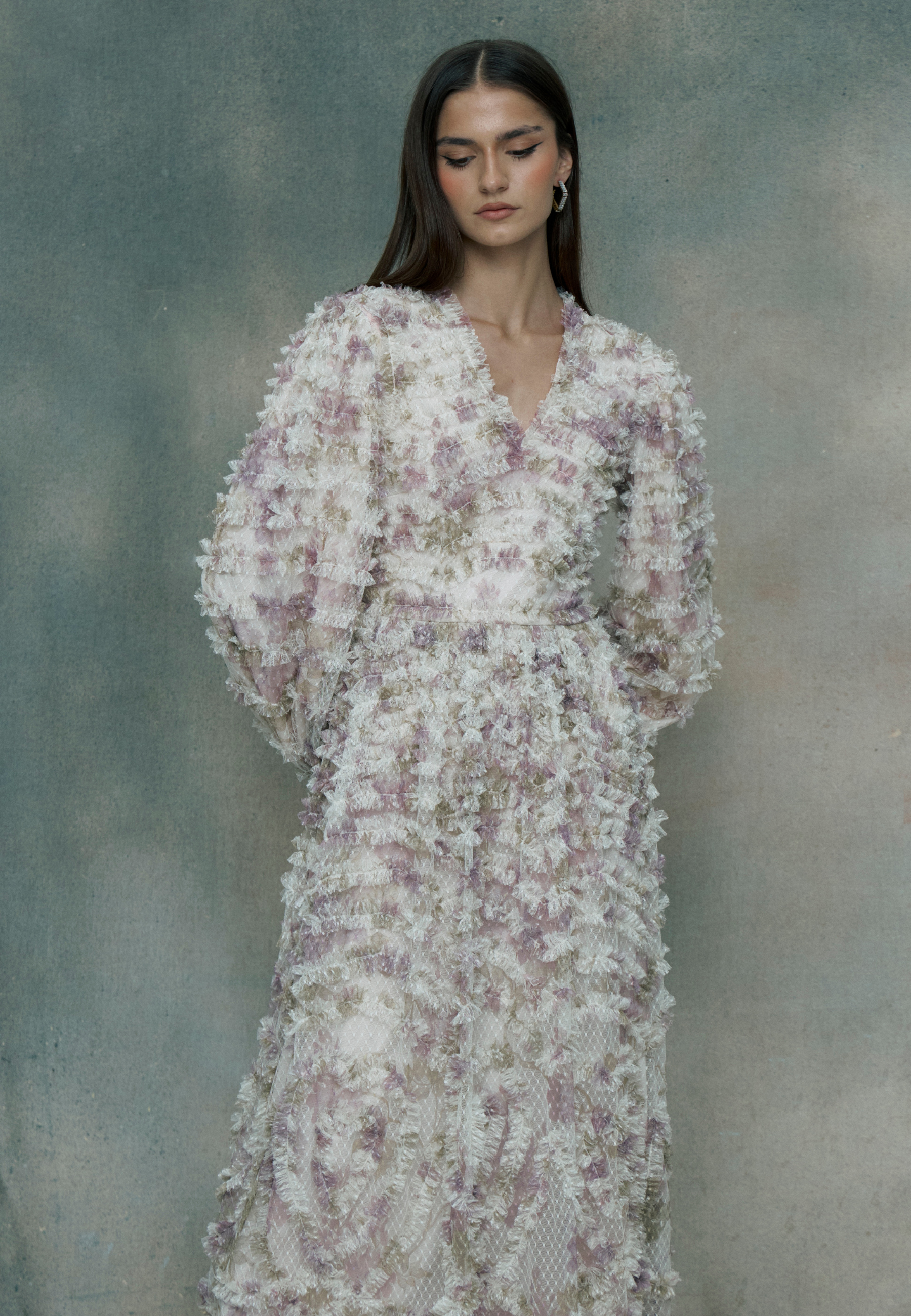 Woman wearing a multicolor ruffle maxi dress, designed by BEAUUT